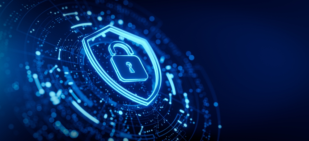 Cybersecurity concept featuring a glowing blue digital shield with a lock icon, surrounded by a network of interconnected data points. Represents cloud security, data protection, and cybersecurity solutions for businesses and healthcare organizations