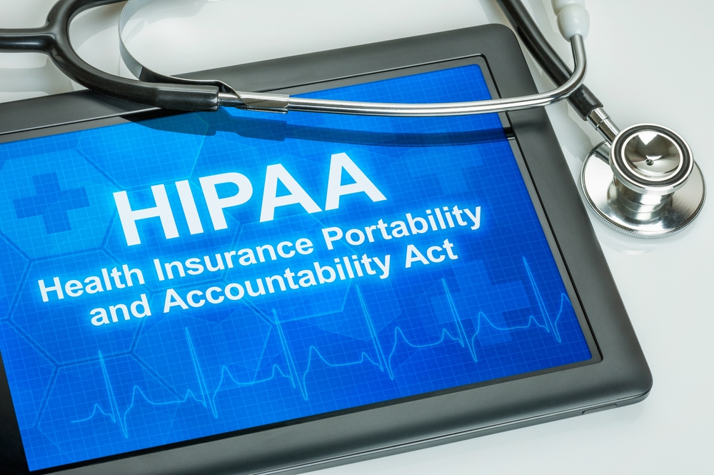 Tablet displaying HIPAA Health Insurance Portability and Accountability Act with stethoscope, symbolizing healthcare data privacy, compliance, and medical cybersecurity standards and reflecting the ultimate point of the blog post which is to outline the proposed changes to the HIPAA security rule.