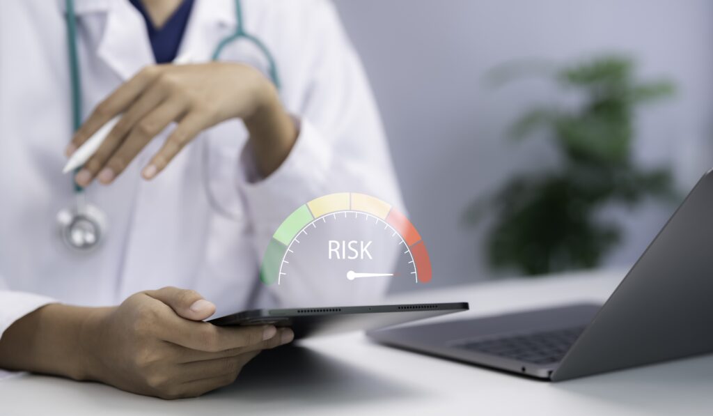 Healthcare Security Risk Assessment showing a healthcare professional reviewing digital security risk levels to help protect patient data, strengthen HIPAA compliance, and identify cybersecurity vulnerabilities.